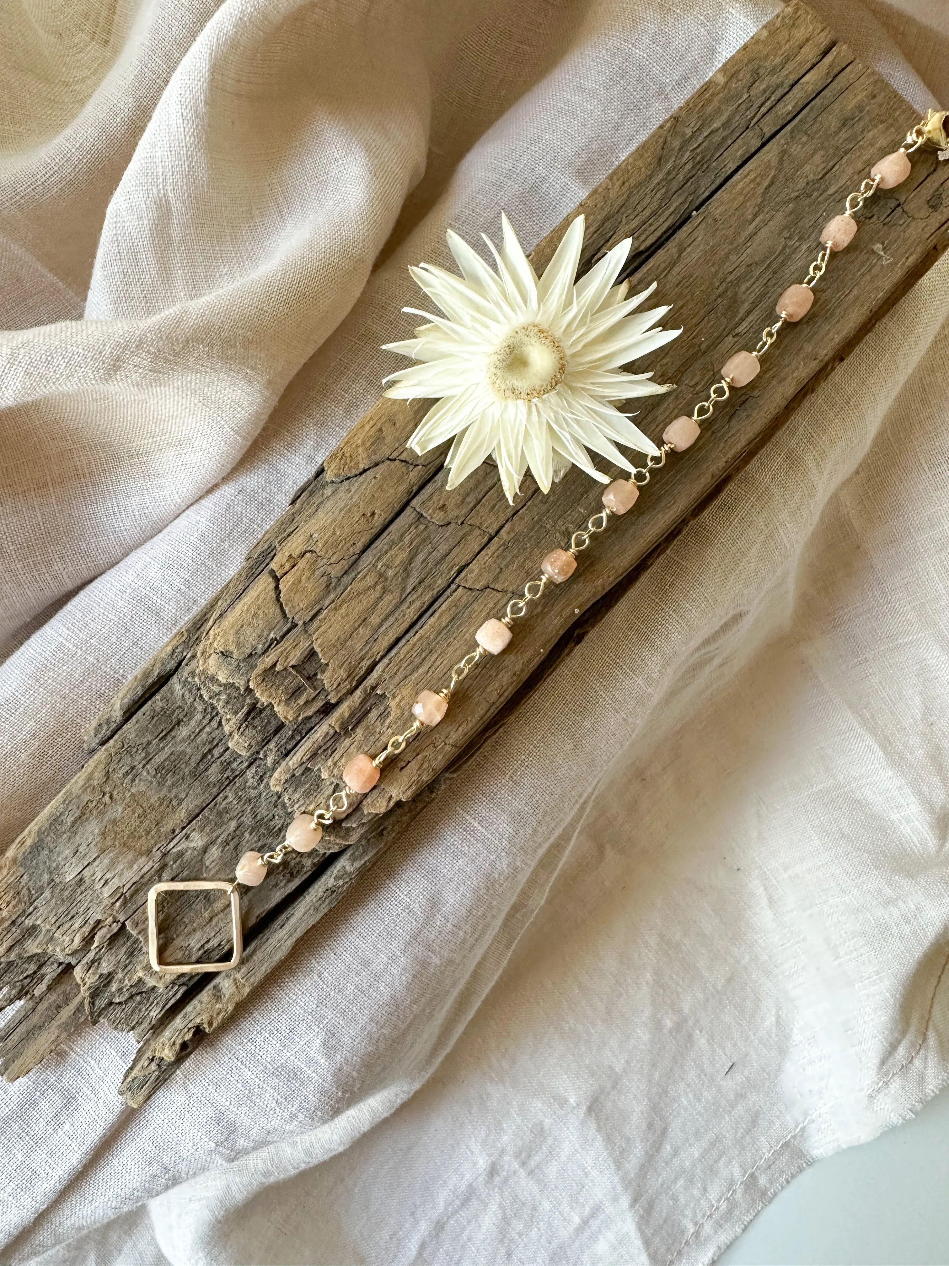 B2303 - gf forged square link with faceted cube shape peach moonstone bracelet