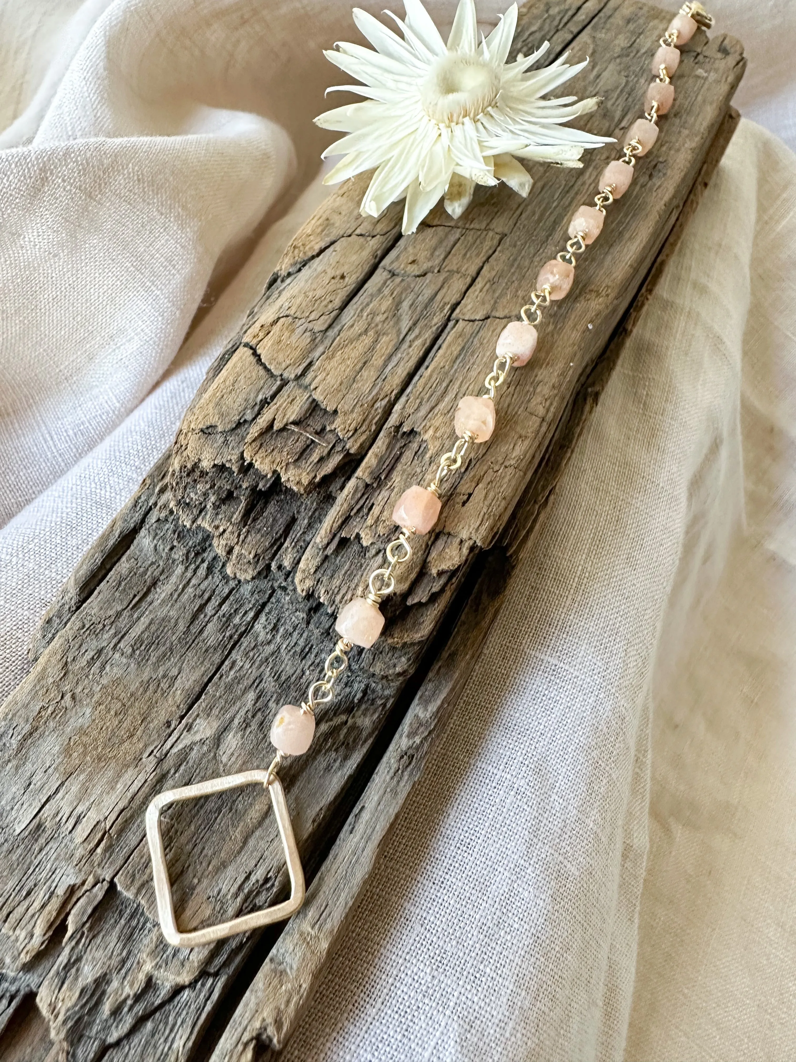 B2303 - gf forged square link with faceted cube shape peach moonstone bracelet