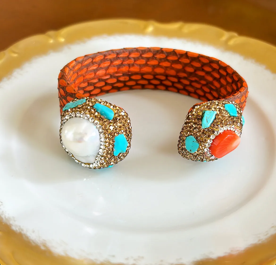 Fabulous statement cuff bracelet with an orange faux skin style banding