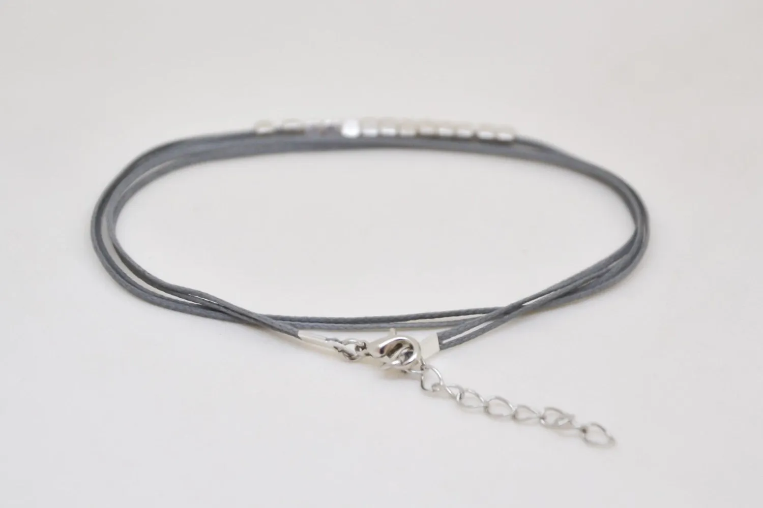 Wrapped gray ankle bracelet with matt silver nugget beads cubes